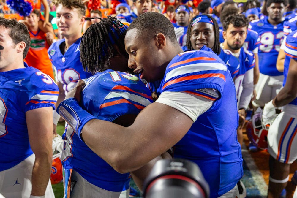 Florida Gators quarterback DJ Lagway (2) embraces Florida Gators running back Jadan Baugh (13) postgame at Steve Spurrier-Florida Field at Ben Hill Griffin Stadium on Saturday, October 19, 2024.