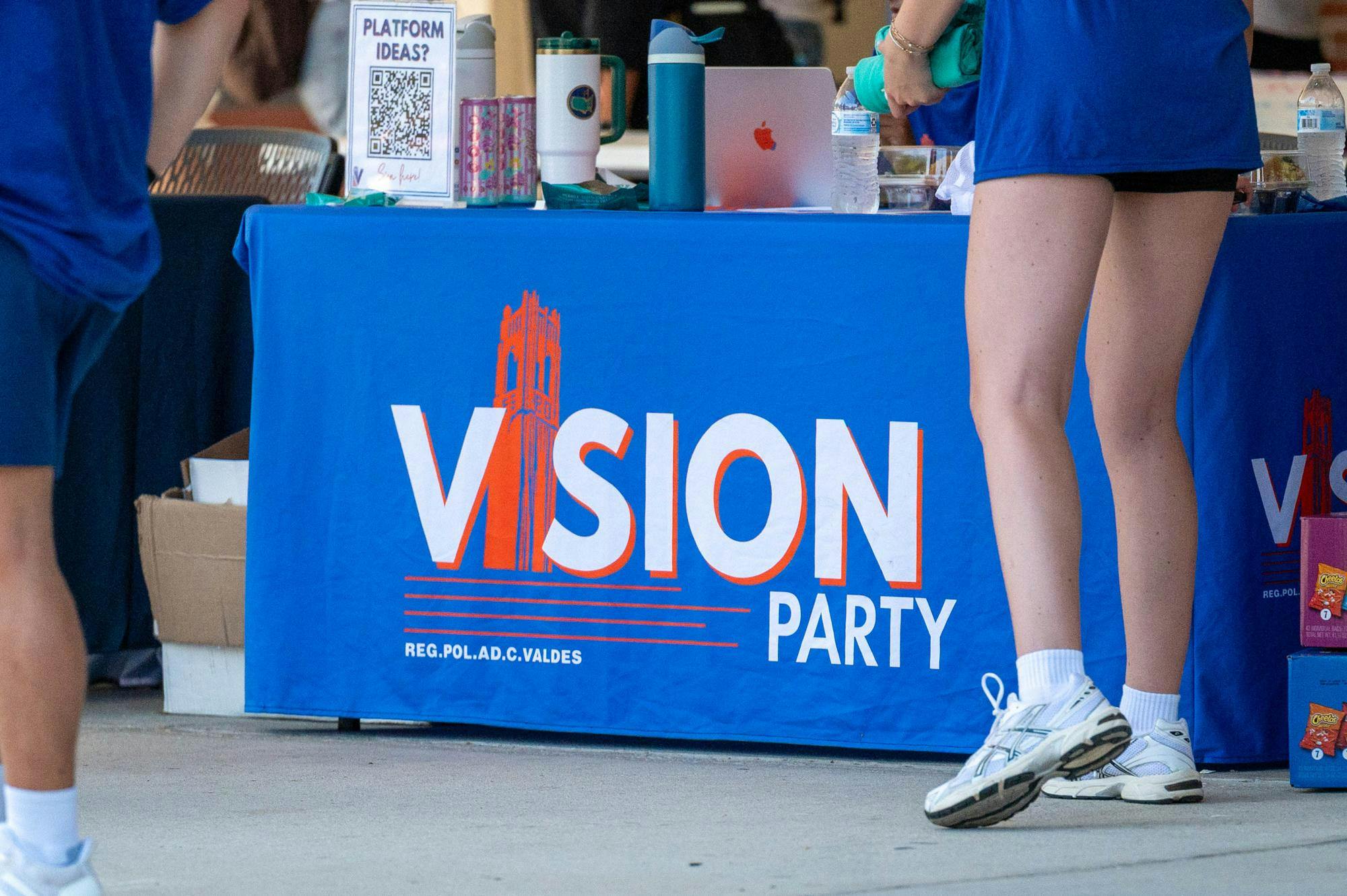 Members of the Vision Party table outside the Reitz Union, Wednesday, Sept. 30, 2026, in Gainesville, Fla.