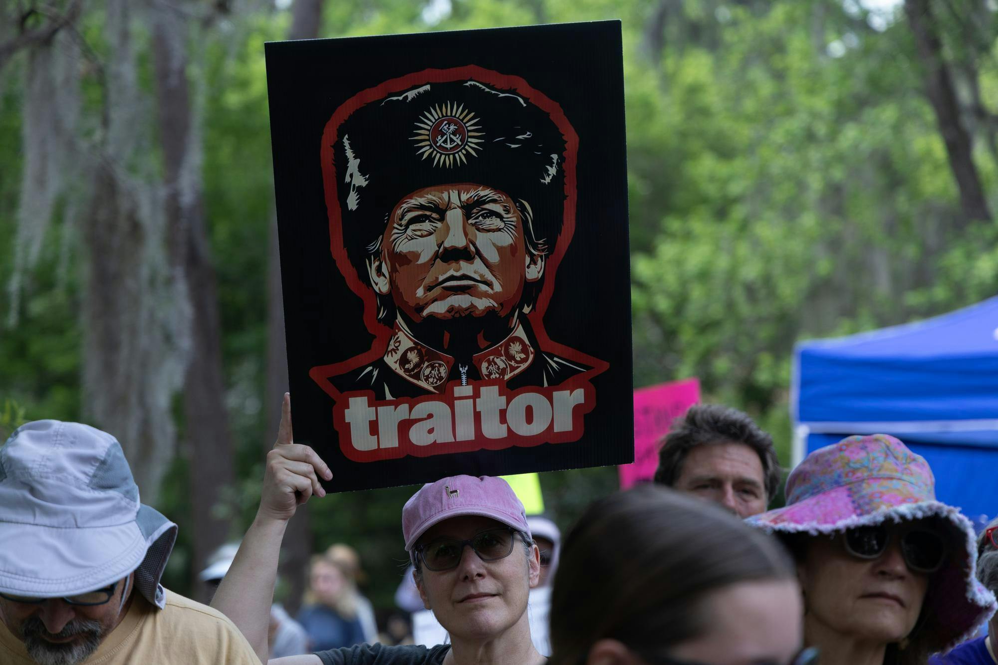  A protester holds a sign of Donald Trump with the word “traitor” underneath him during the No Kings Protest at Cora P. Roberson Park in Gainesville, Fla., Saturday, March 28, 2026.