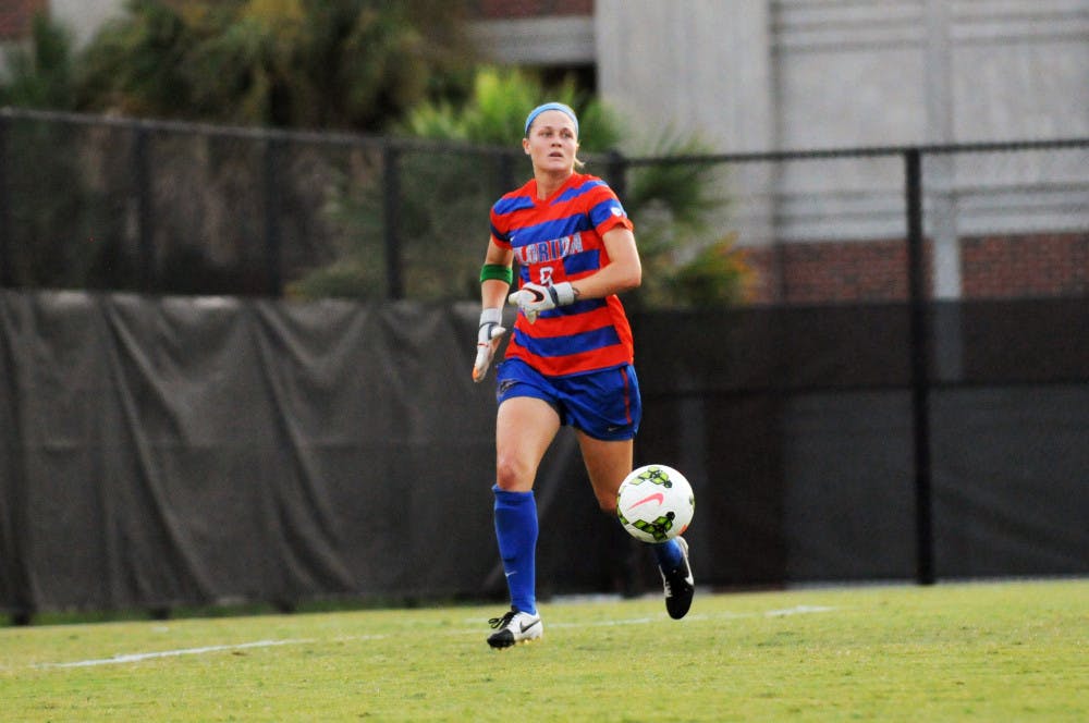 <p>Goalkeeper Val Tysinger chases the ball during Florida's 2-1 win against Troy in an exhibition match on Aug. 11, 2015, at the soccer practice field at Donald R. Dizney Stadium.</p>