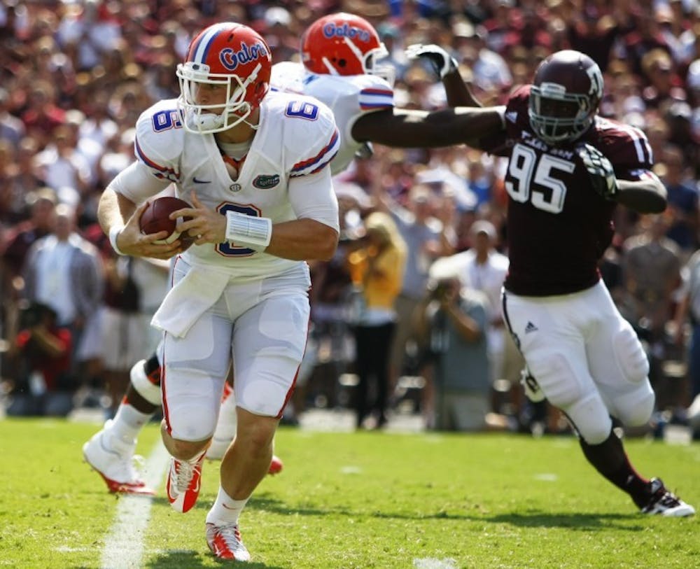 <p>Sophomore quarterback Jeff Driskel (6) escapes the pass rush during UF's 20-17 win on Saturday at Kyle Field.</p>