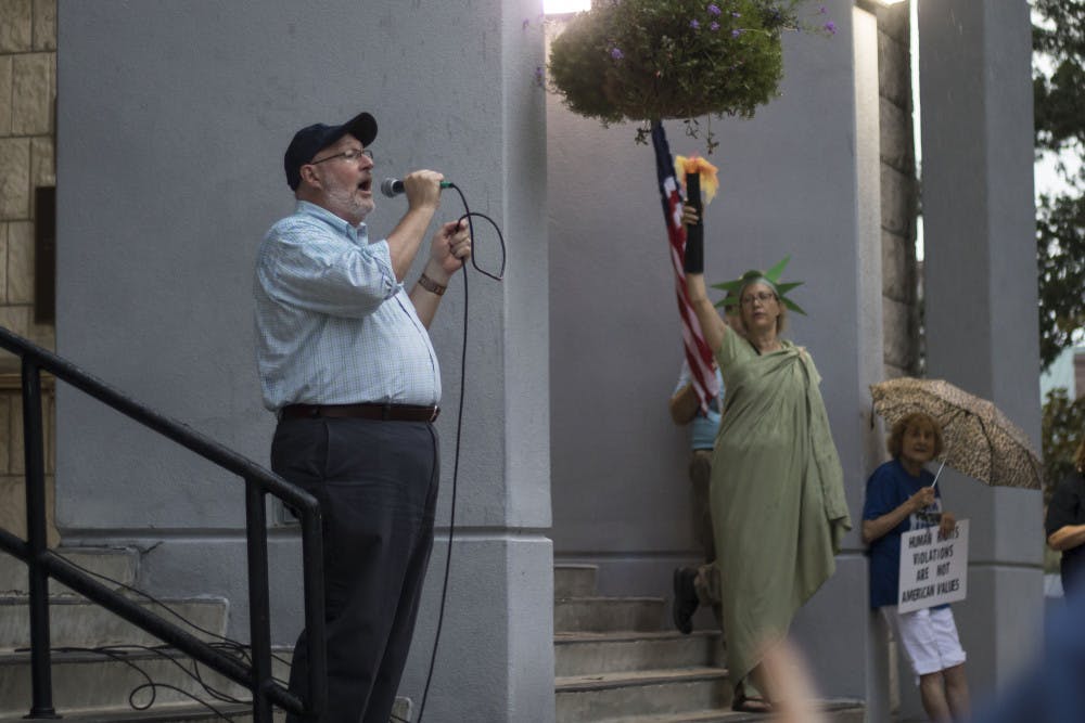 At a recent Gainesville protest, City Commissioner Harvey Ward asked the crowd to support the city joining the lawsuit. 