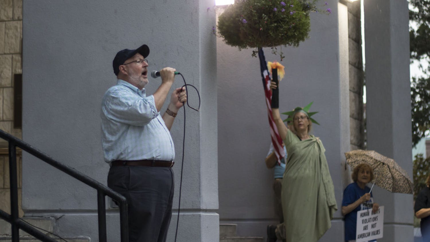 At a recent Gainesville protest, City Commissioner Harvey Ward asked the crowd to support the city joining the lawsuit. 