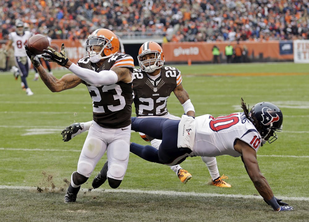 <p>Cleveland Browns cornerback Joe Haden (23) intercepts a pass intended for Houston Texans wide receiver DeAndre Hopkins in the first quarter of an NFL football game Sunday, Nov. 16, 2014, in Cleveland.</p>