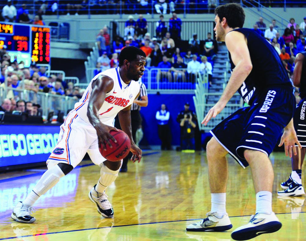 Eli Carter dribbles the ball during Florida’s 77-69 win against North Florida on Nov. 1 in the O’Connell Center. Carter plans to receive a medical redshirt this season.