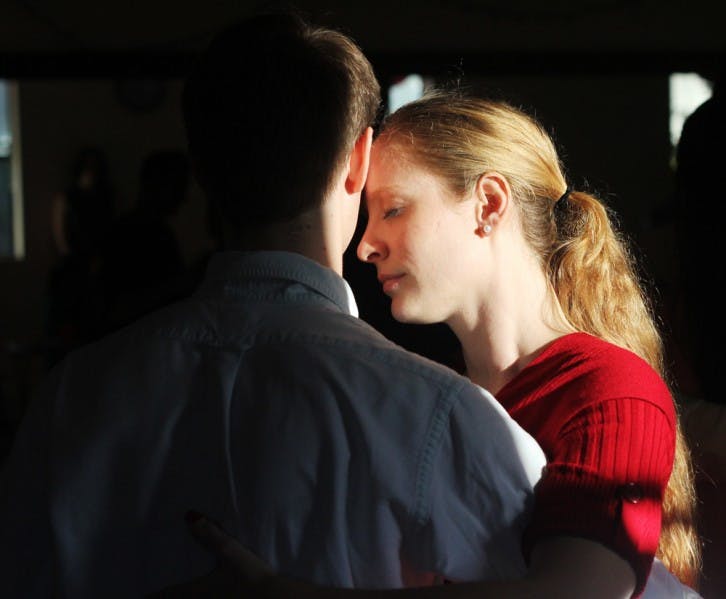 Trista Brophy, 27, a USF global sustainability and environmental science graduate student, dances the tango with Kyle Kirwan, 22, a UF fifth-year industrial and systems engineering student, at the Combilonga Tango Social on Sunday evening.