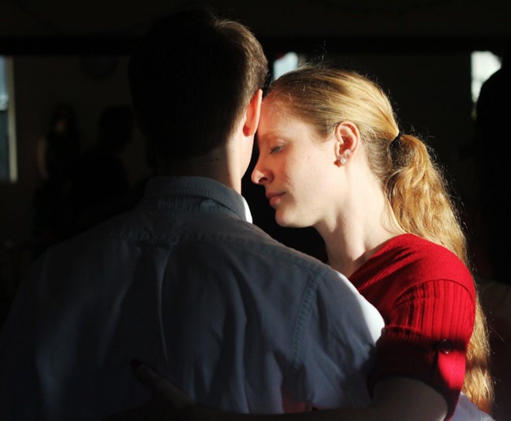 <p>Trista Brophy, 27, a USF global sustainability and environmental science graduate student, dances the tango with Kyle Kirwan, 22, a UF fifth-year industrial and systems engineering student, at the Combilonga Tango Social on Sunday evening.</p>