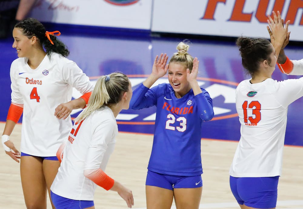 <p>Florida volleyball&#x27;s Elli McKissock (23), Sofia Victoria (4), Marlie Monserez (21) and Merritt Beason (13) celebrate during the Gators&#x27; loss to Mississippi State on Sept. 24. The team hosted Jacksonville Saturday for its annual Fan Day exhibition match. </p>