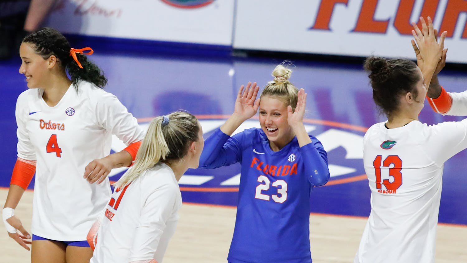 Florida volleyball&#x27;s Elli McKissock (23), Sofia Victoria (4), Marlie Monserez (21) and Merritt Beason (13) celebrate during the Gators&#x27; loss to Mississippi State on Sept. 24. The schedule for the 2022 season released Friday.