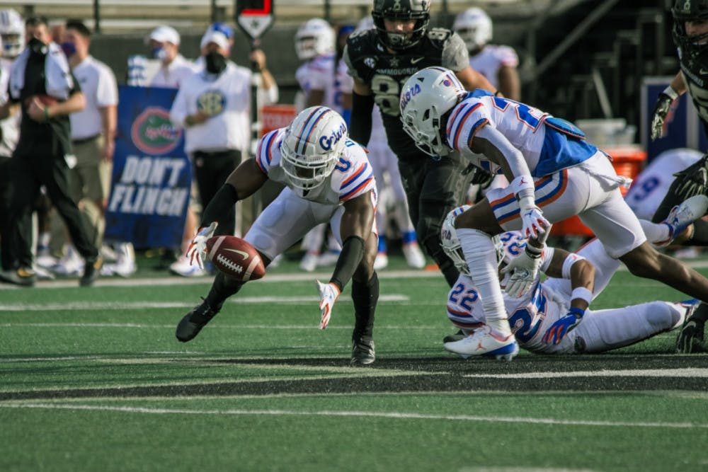 <p>Gators safety Trey Dean III reaches for the football in Florida's game against Vanderbilt. The Gators hung 38 points on the Commodores in Nashville, Tennessee, on Saturday, winning their sixth game of the season.</p>