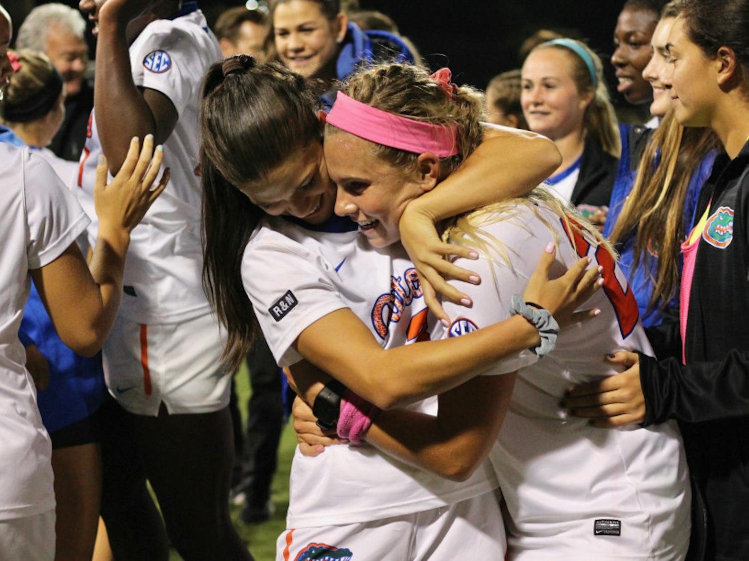 Jessie Holmes and Parker Roberts hug after Florida's 1-0 over USF in the second round of the NCAA Tournament.