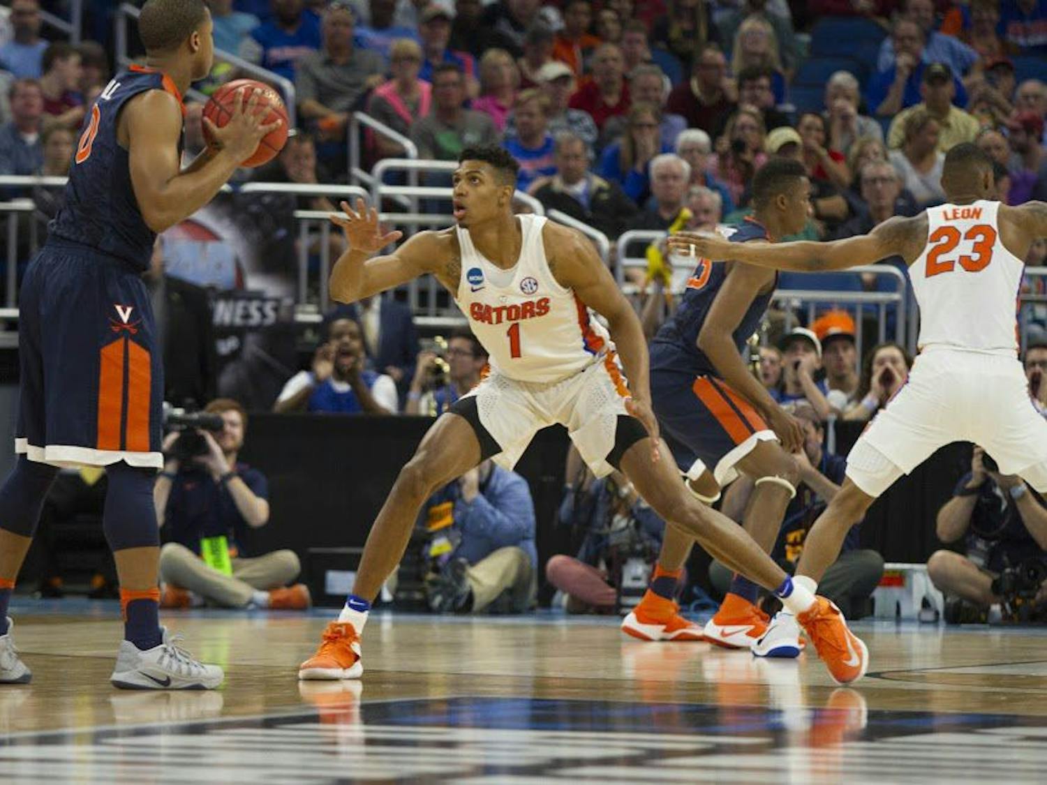 UF forward Devin Robinson guards a Virginia player during Florida's 65-39 win against the Cavaliers in the NCAA Tournament on Saturday in Orlando.