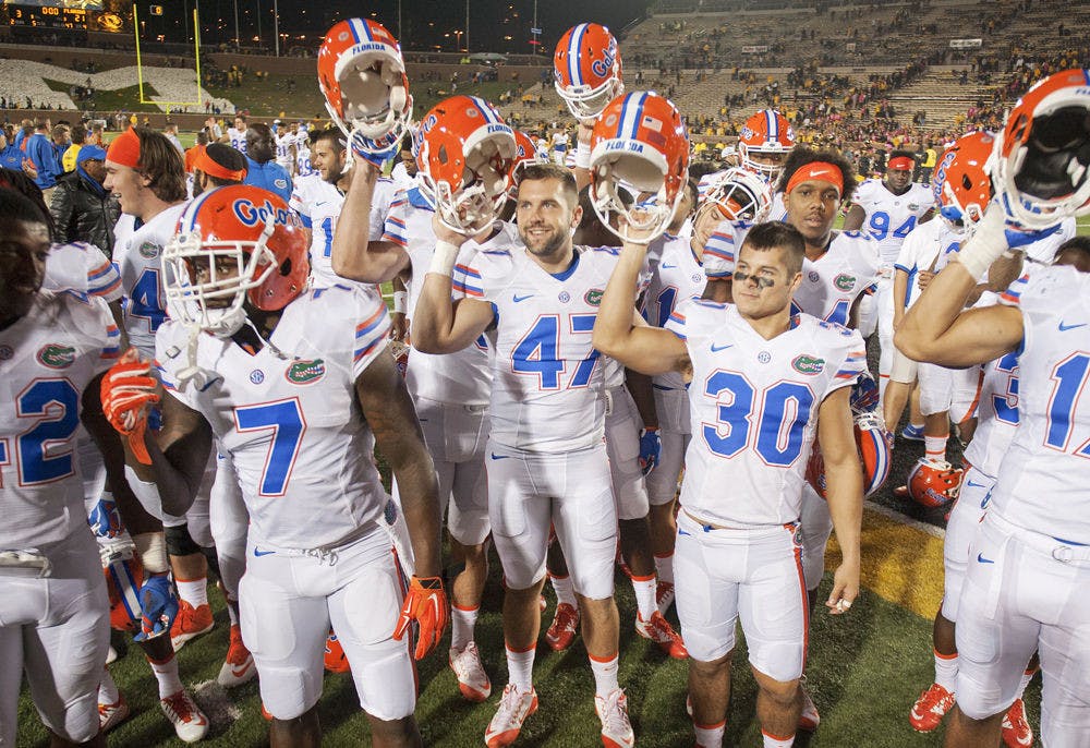 <p>Florida teammates celebrate with fans after a 21-3 win against Missouri on Oct. 10, 2015, on Faurot Field at Memorial Stadium in Columbia, Missouri.</p>