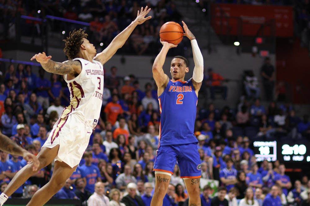 Sophomore guard Riley Kugel attempts a jumper in the Gators' 89-68 win against the Florida State Seminoles on Friday, Nov. 17, 2023.