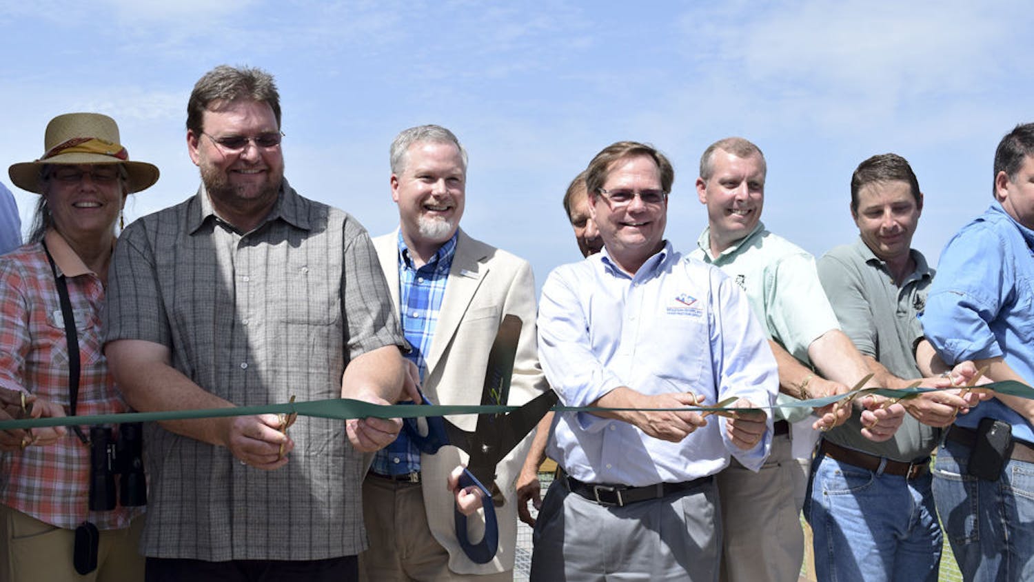 From left: Helen Warren, City Commissioner; Brad Purcell, South Florida Water Management District; Ed Braddy, Mayor; David Lewis, Wharton Smith; Chris Wynn, Florida Fish and Wildlife; Chris Keller, Wetland Solutions; and Tom Frick, FDEP, cut the ribbon at Friday's grand opening of Sweetwater Wetlands Park, located at 325 SW Williston Road.