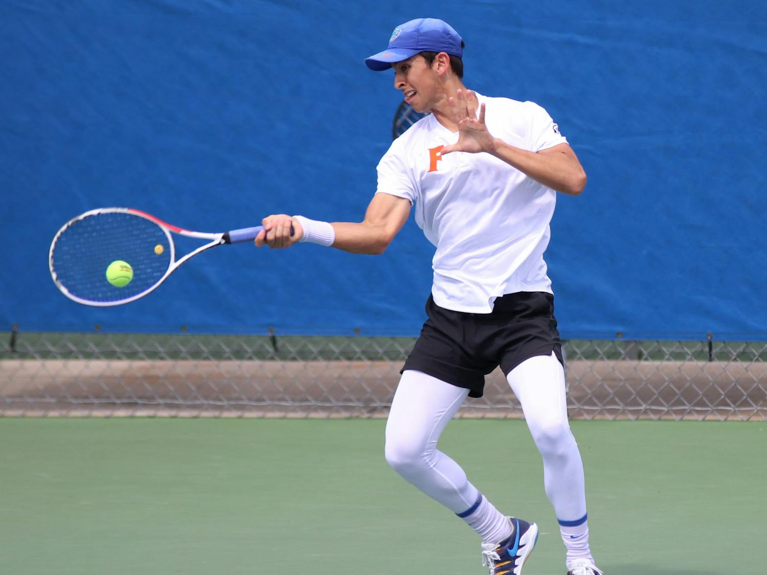 Florida&#x27;s Andy Andrade returns a ball against Auburn on February 21, 2021. Andrade won the Gators&#x27; first match Friday with a three-set victory over TCU&#x27;s Tomas Jirousek.
