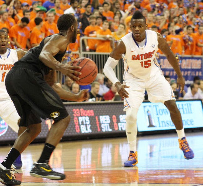 Junior forward Will Yeguete (15) plays defense during Florida’s 83-52 victory against Missouri on Saturday in the O’Connell Center. Yeguete will miss 4-6 weeks with bone chips in his right knee.