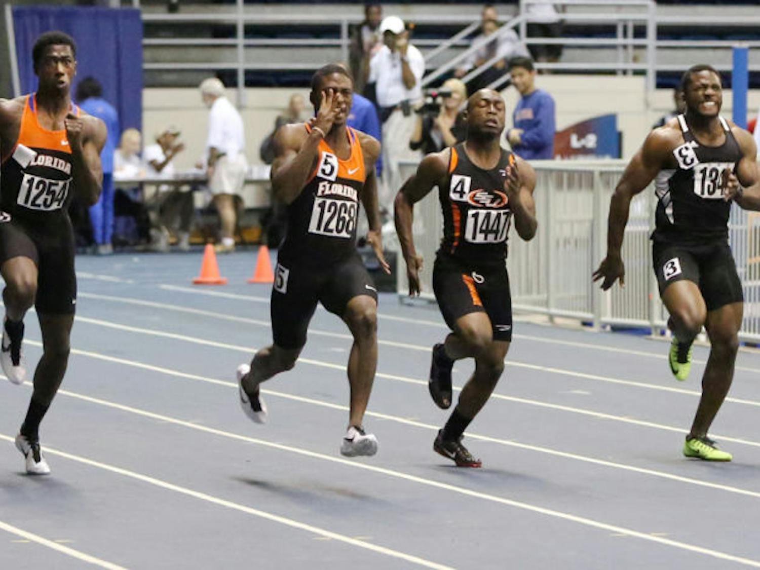 Marquis Dendy (far left) races in the 55m on Jan. 17, 2013, during the Gator Invitational in the O’Connell Center. Dendy finished first in the long jump at the Texas Relays.