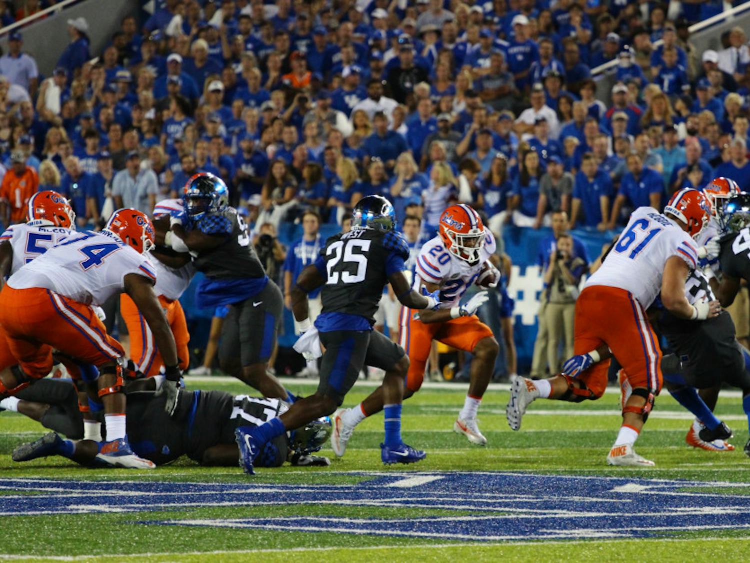 UF offensive lineman Brett Heggie blocks for Malik Davis during Florida's 28-27 win against Kentucky on Sep. 23, 2017, at Kroger Field.
