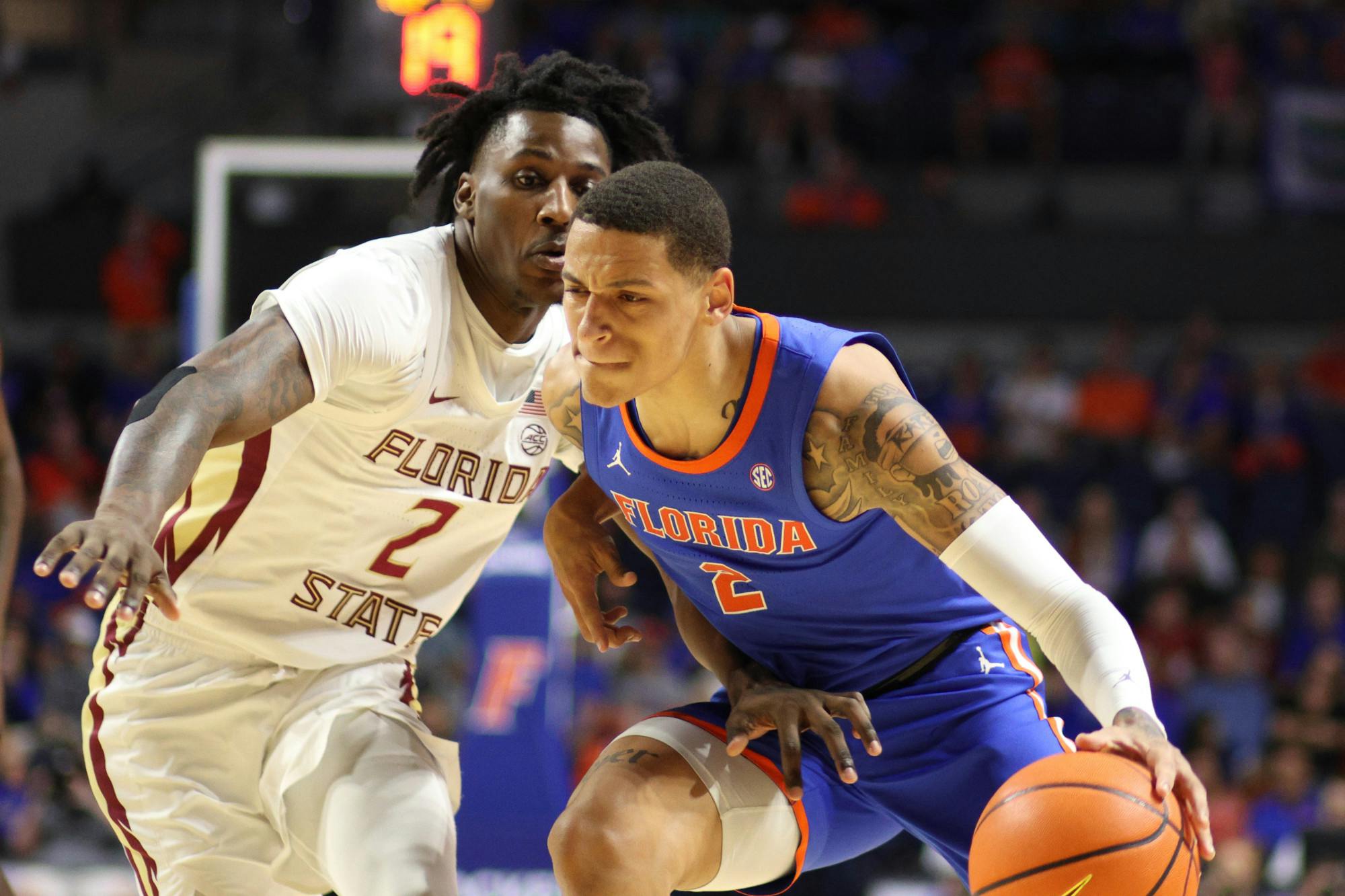 Sophomore guard Riley Kugel drives the ball in the Gators' 89-68  against the Florida State Seminoles on Friday, Nov. 17, 2023. 