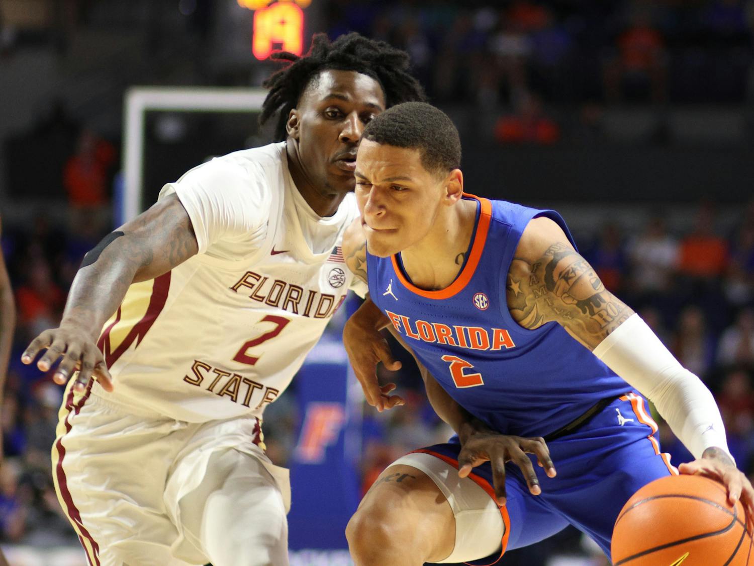 Sophomore guard Riley Kugel drives the ball in the Gators' 89-68  against the Florida State Seminoles on Friday, Nov. 17, 2023. 