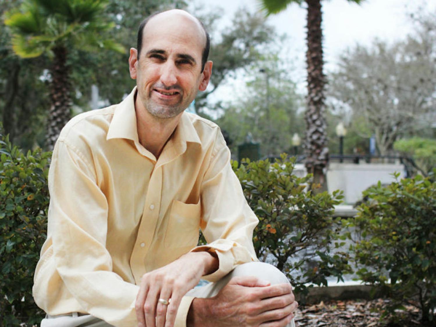 Current District 4 Gainesville City Commissioner Randy Wells sits on a ledge at City Hall on Feb. 12. Wells is the current chairman of the Equal Opportunity Committee and Metropolitan Transportation Planning Organization.