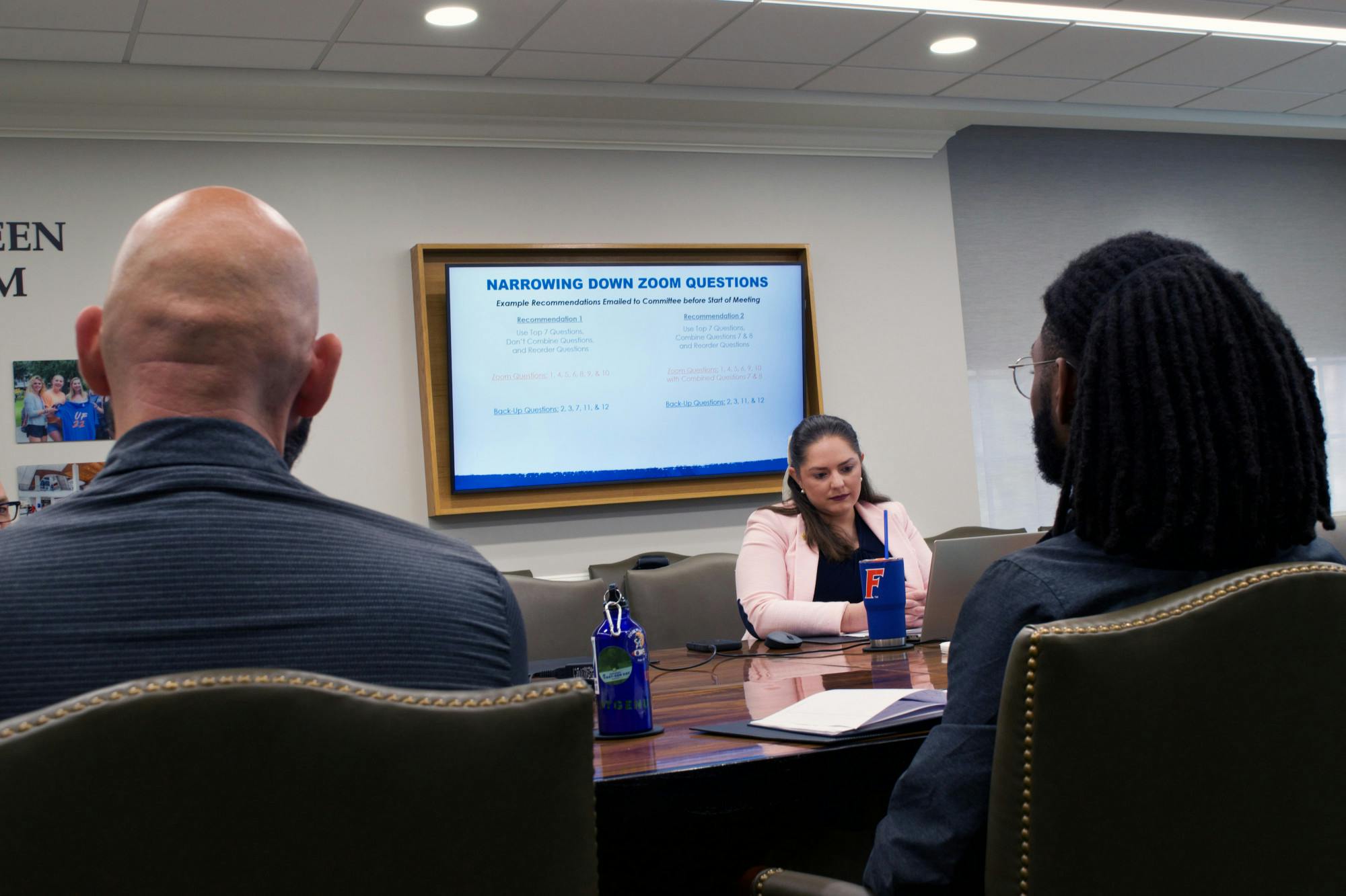 Three members of the search committee for the Director of the Honors Program review interview questions in the Dr. C. Author Sandeen conference room Friday, Feb. 17, 2023.