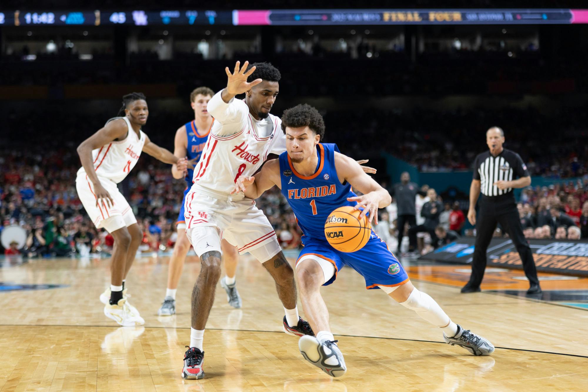 Florida Gators guard Walter Clayton Jr. (1) drives with the ball during a basketball game against the Houston Cougars in the National Championship round of the NCAA Tournament on Monday, April 7, 2025, in San Antonio, Texas.