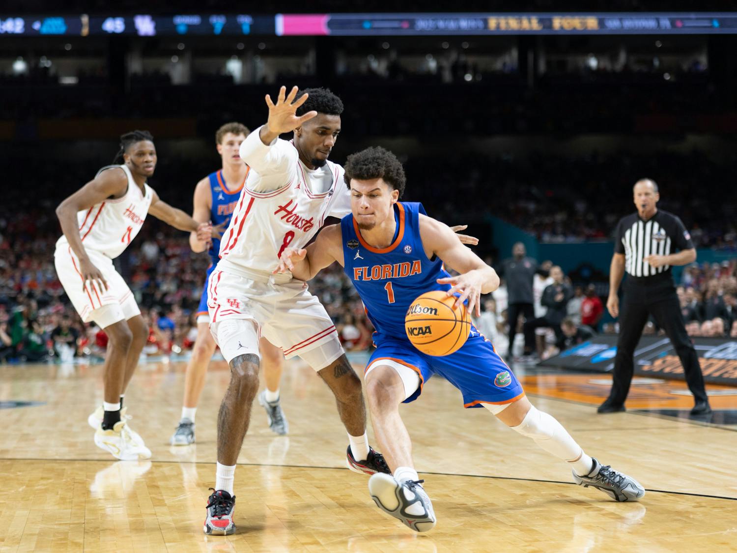 Florida Gators guard Walter Clayton Jr. (1) drives with the ball during a basketball game against the Houston Cougars in the National Championship round of the NCAA Tournament on Monday, April 7, 2025, in San Antonio, Texas.