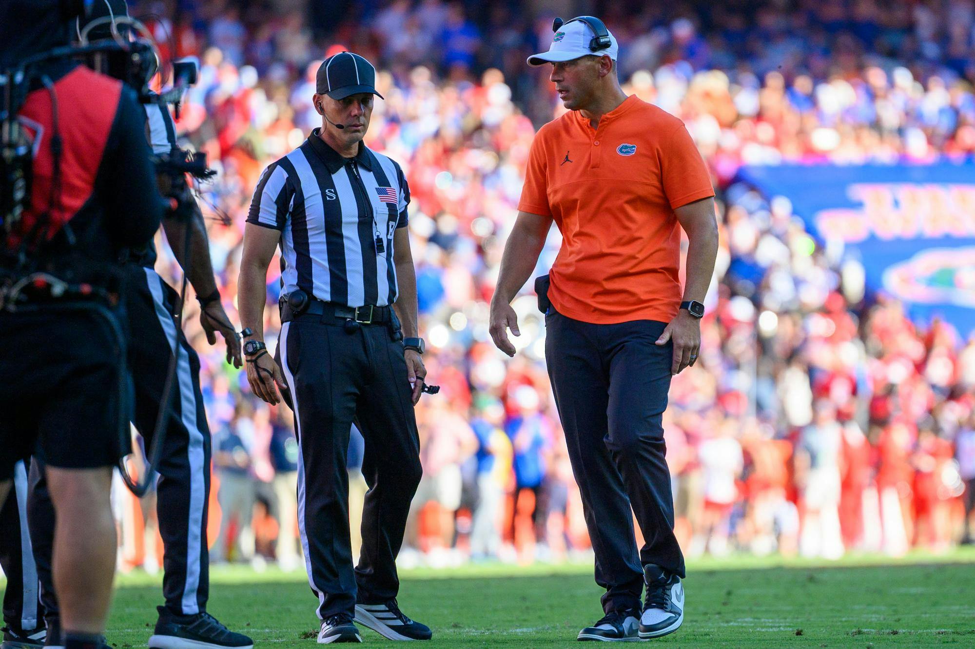 Florida head coach Jon Sumrall speaks to referees after wide receiver Bailey Stockton (3) goes down during the first half of an NCAA college football game against Ole Miss, Saturday, Sept. 26, 2026, in Gainesville, Fla.