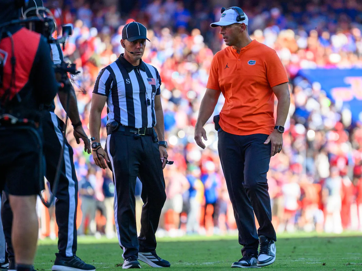 Florida head coach Jon Sumrall speaks to referees after wide receiver Bailey Stockton (3) goes down during the first half of an NCAA college football game against Ole Miss, Saturday, Sept. 26, 2026, in Gainesville, Fla.