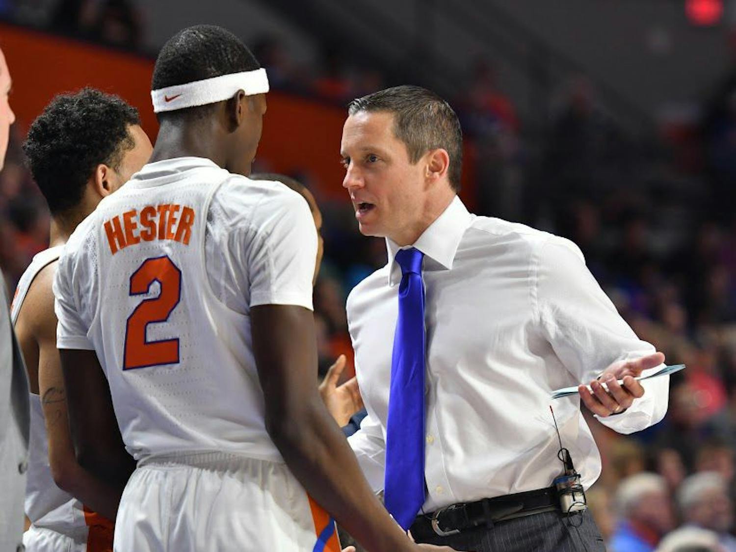 UF guard Eric Hester talks with coach Mike White during Florida's 94-71 win over the University of Arkansas at Little Rock on Dec. 21, 2016, in the O'Connell Center.