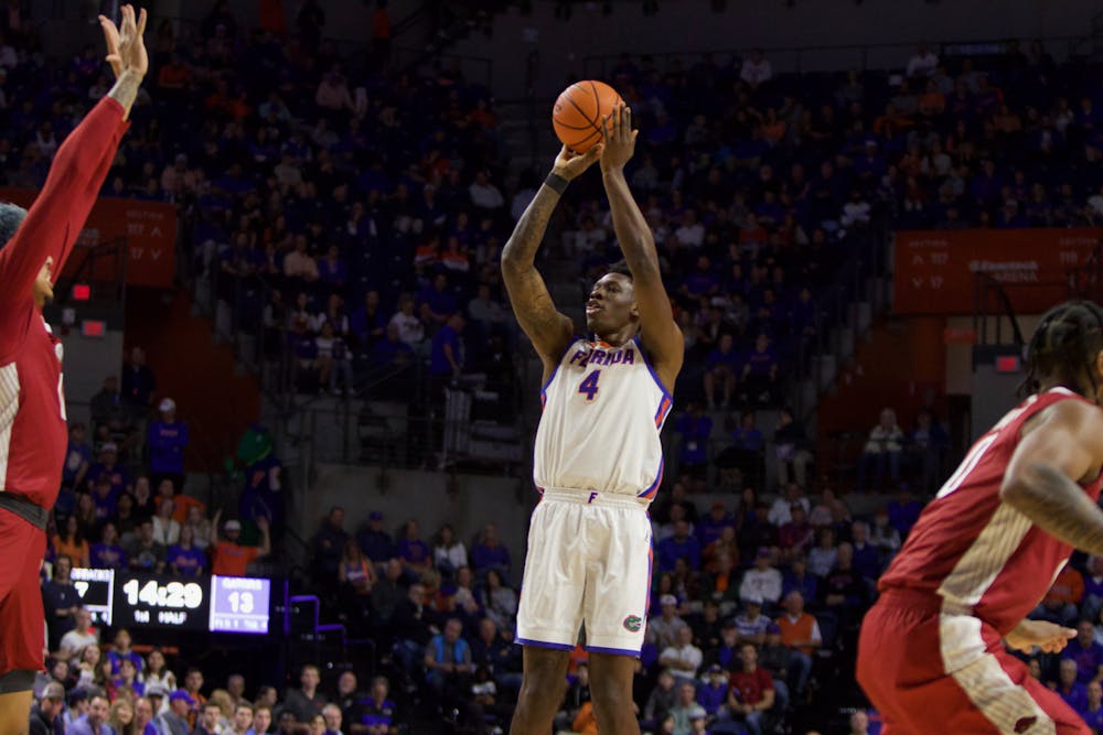 Graduate student forward Tyrese Samuel shoots a 3-pointer in the Gators' 90-68 win over Arkansas on Saturday, January 13, 2023. 