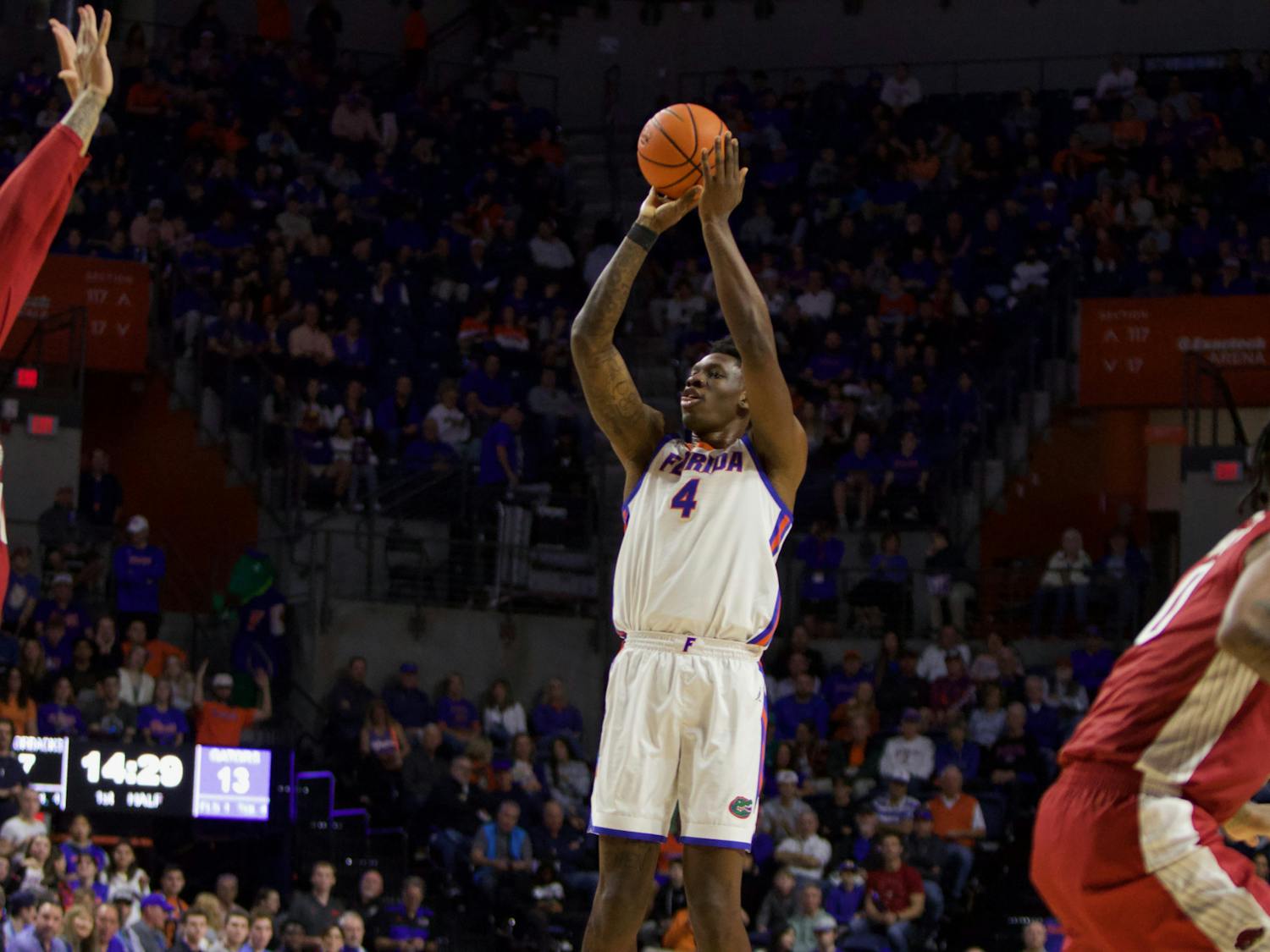 Graduate student forward Tyrese Samuel shoots a 3-pointer in the Gators' 90-68 win over Arkansas on Saturday, January 13, 2023. 