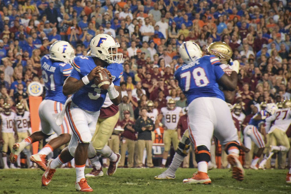 <p>UF quarterback Treon Harris scrambles in the pocket during Florida's 27-2 loss to Florida State on Nov. 28, 2015, at Ben Hill Griffin Stadium.</p>