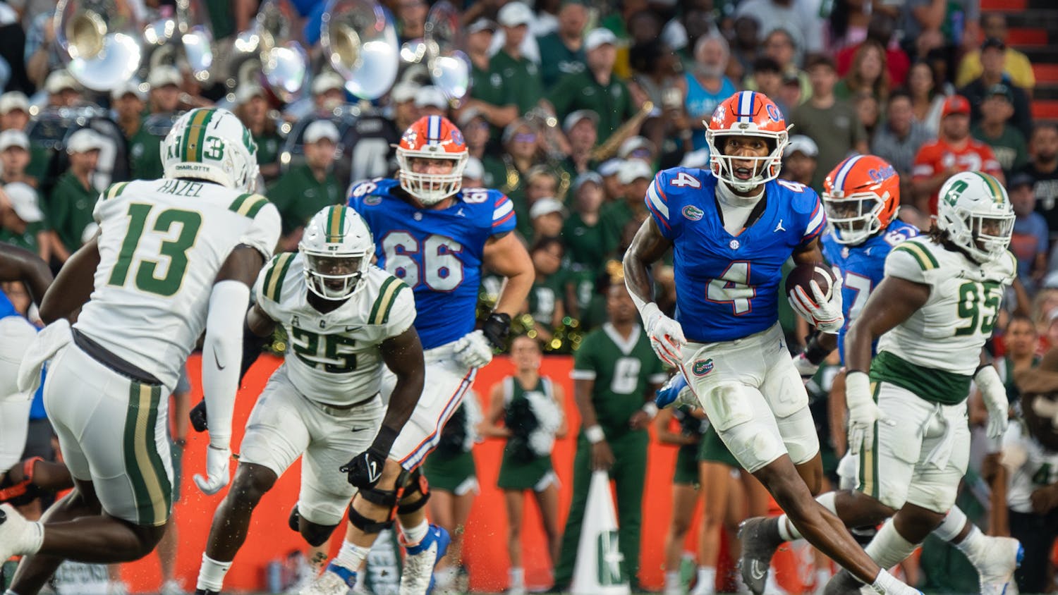 Sophomore wide receiver Caleb Douglas runs with the ball in the Gators' 22-7 win against the Charlotte 49ers on Saturday, Sept. 23, 2023.