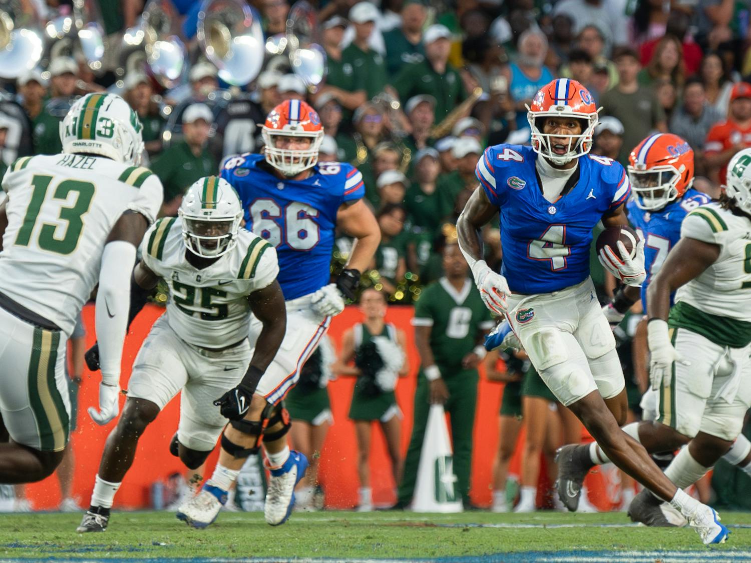 Sophomore wide receiver Caleb Douglas runs with the ball in the Gators' 22-7 win against the Charlotte 49ers on Saturday, Sept. 23, 2023.