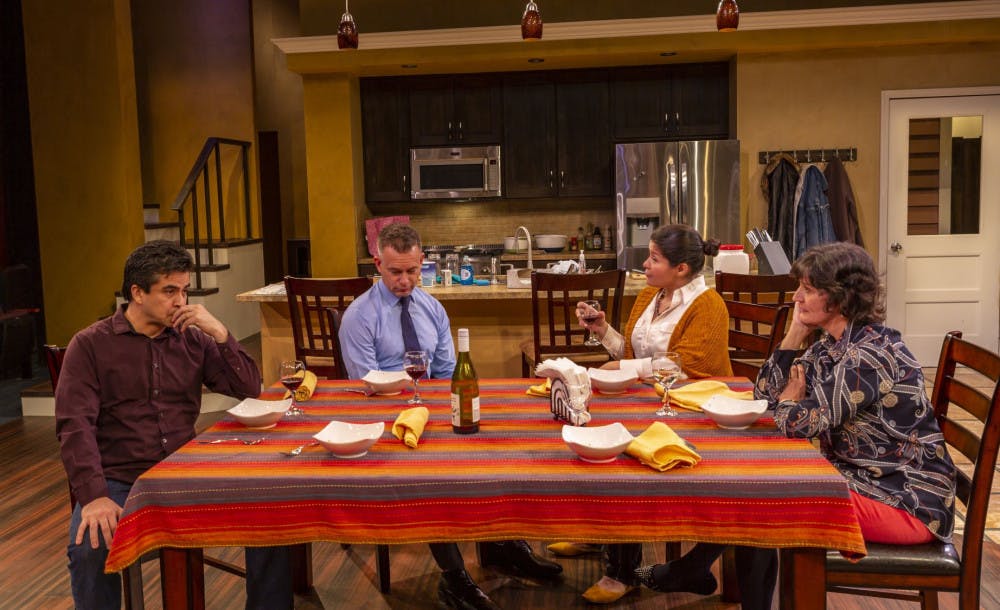 (L-R) Actors Alberto Bonilla, Tim Altmeyer, Maylin Castro and Maryann Towne at the dinner table in the Hippodrome's "The Blameless."