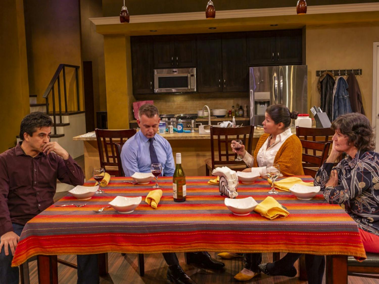 (L-R) Actors Alberto Bonilla, Tim Altmeyer, Maylin Castro and Maryann Towne at the dinner table in the Hippodrome's "The Blameless."