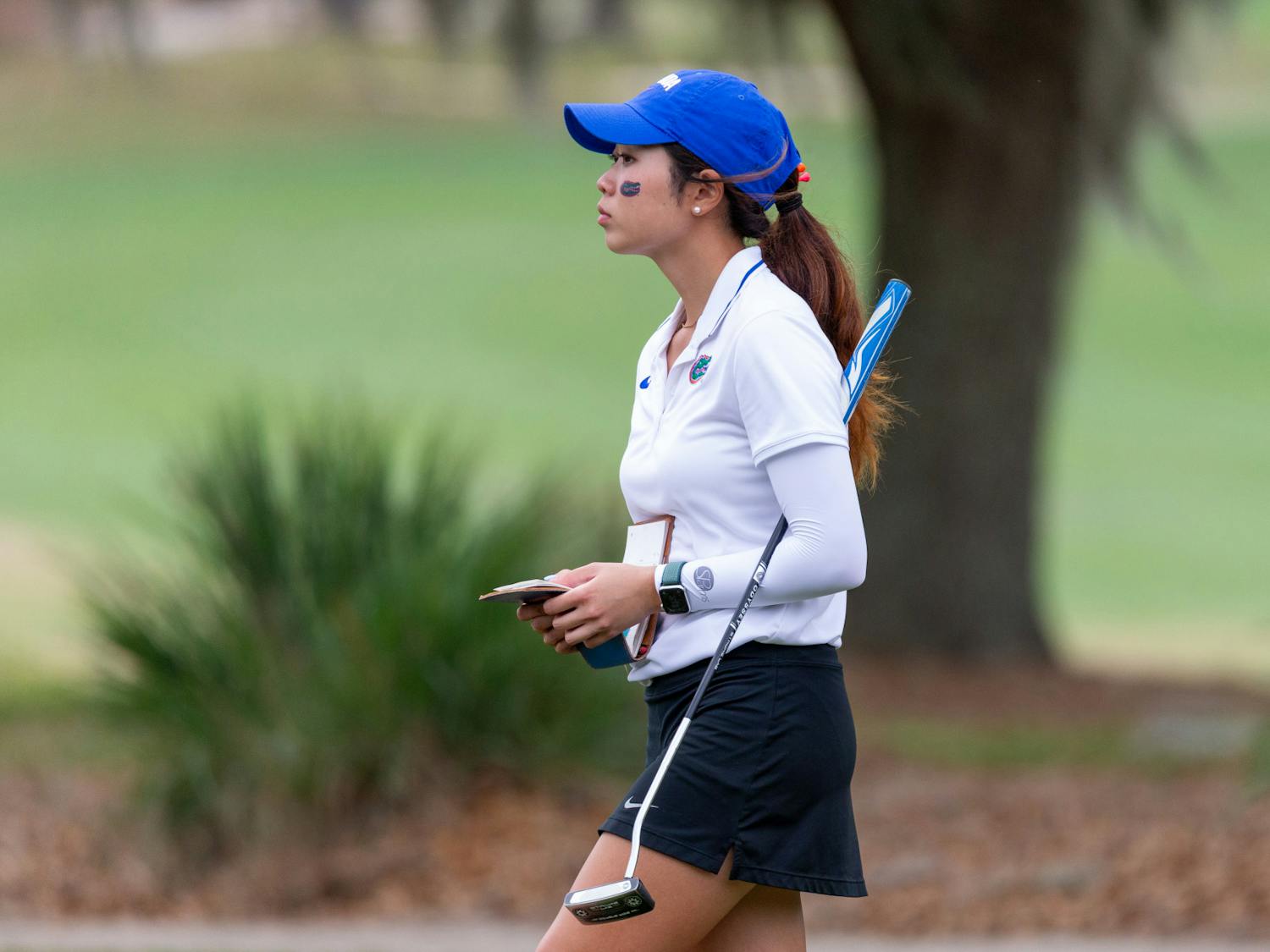 Florida junior golfer Sarunchana Rattanasin records her score after finishing up a hole at the Gators Invitational on Friday, March 1, 2024. 