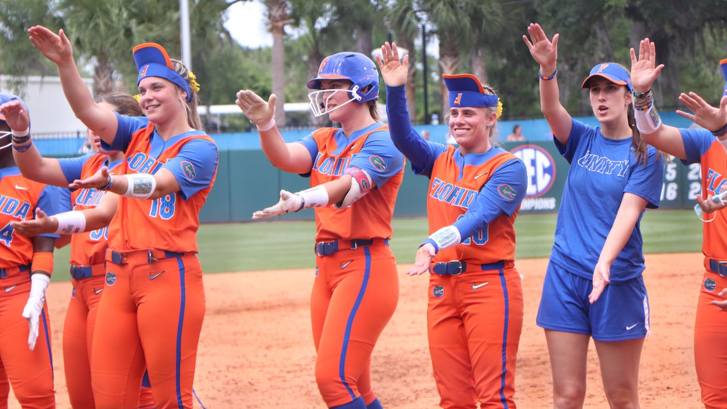 Members of the Florida softball team celebrate after a 1-0 victory over USF Friday