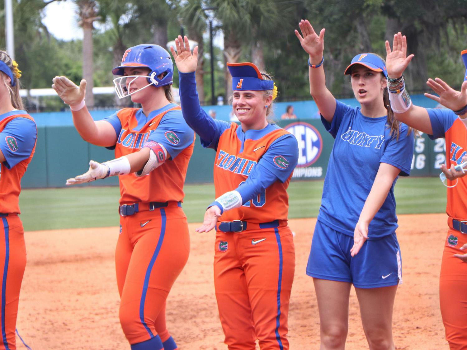 Members of the Florida softball team celebrate after a victory over USF May 21, 2021. Florida fell to UCLA Sunday, ending its season.