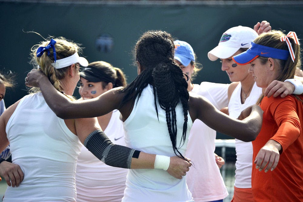 The Florida women's tennis team huddles prior to its win against Maryland on Jan. 24, 2015, at the Ring Tennis Complex.