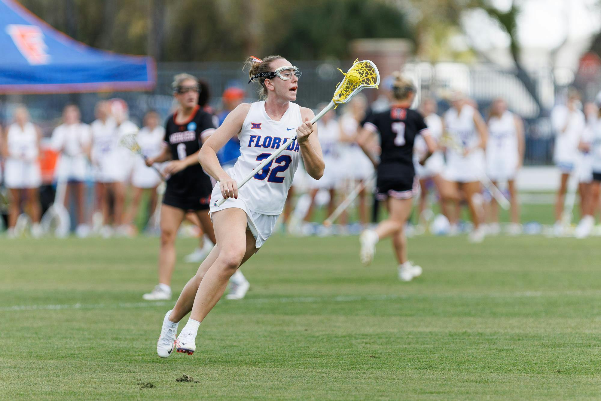 Florida attacker Ava Tighe (32) yells during the first quarter of an NCAA women’s lacrosse gmae against Mercer, Saturday, March 07, 2026, in Gainesville, Fla.