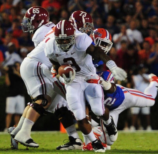 Alabama running back Trent Richardson (center) had a career-high 181 rushing yards and two touchdowns in the Crimson Tide’s 38-10 win against Florida on Saturday in The Swamp.