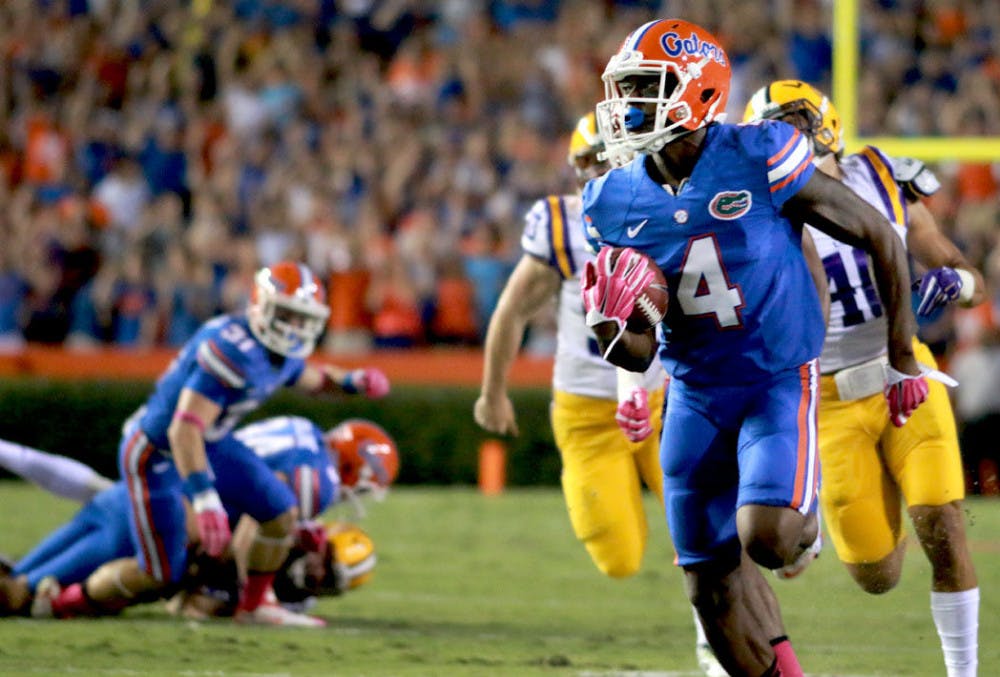 <p>Redshirt senior wide receiver Andre Debose returns a punt for a touchdown during the first quarter of Florida's 30-27 loss to LSU at Ben Hill Griffin Stadium.</p>