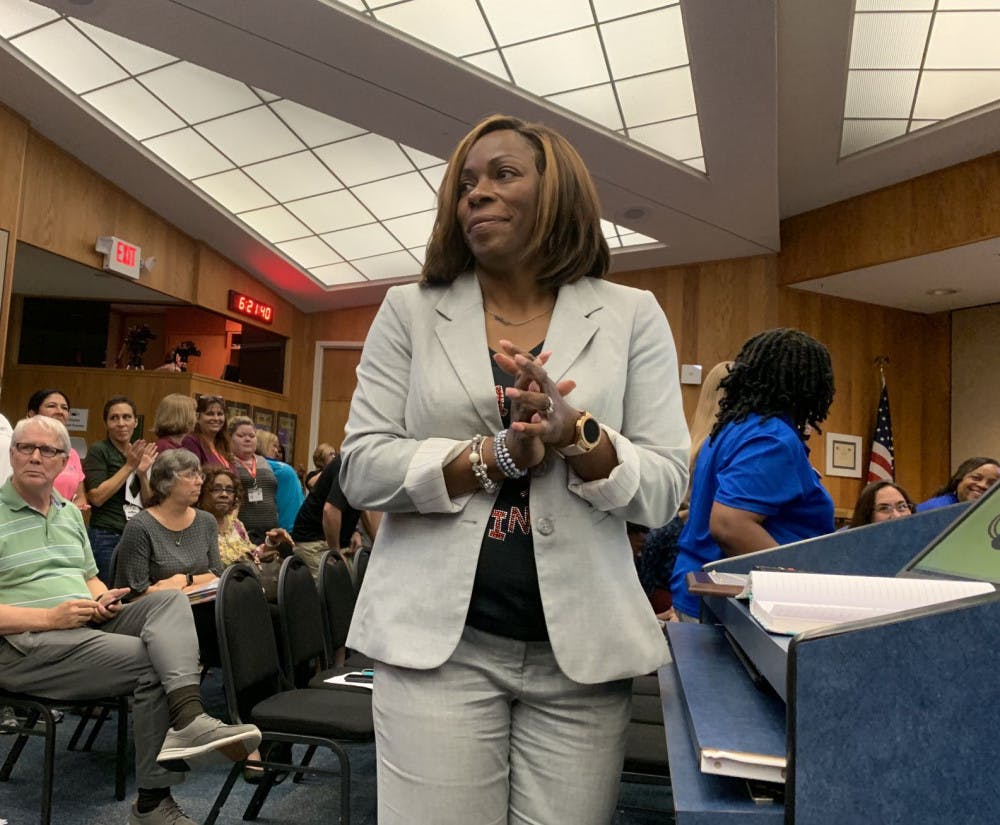 Natalie Strappy, executive director of the Alachua County School District’s Head Start program, invites employees, parents and members of the program to stand and be recognized during a proclamation at Tuesday’s school board meeting.