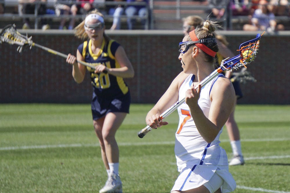 Shayna Pirreca passes the ball during Florida's 12-11 win over Michigan on Feb. 13, 2016, at Donald R. Dizney Stadium.