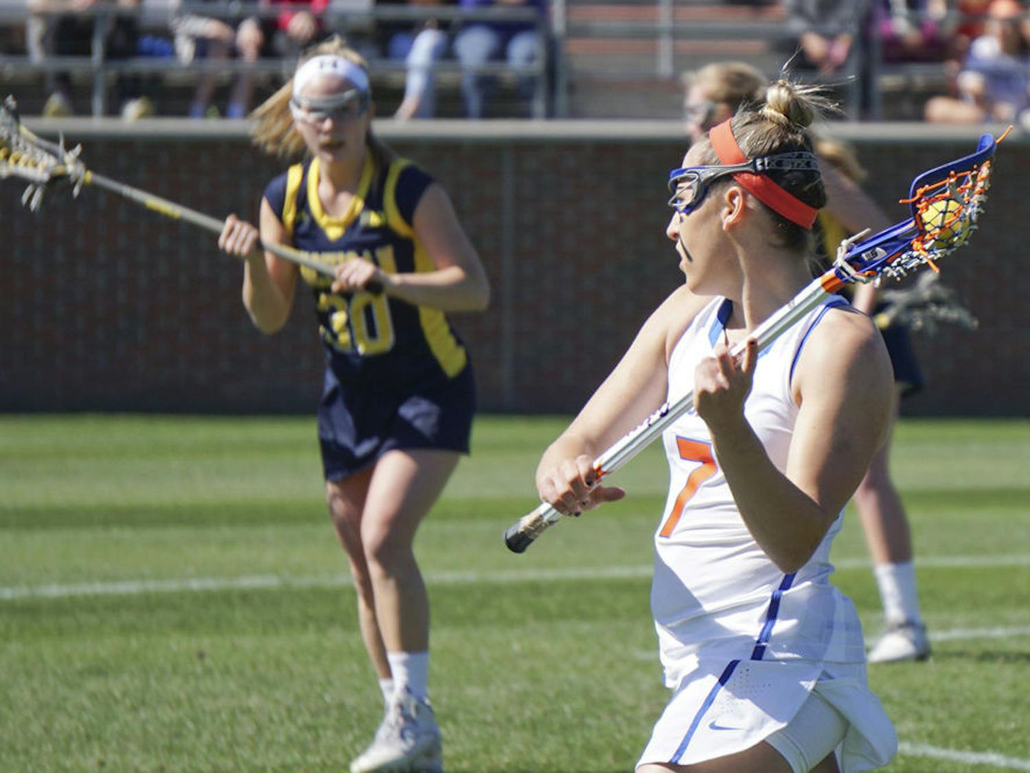 Shayna Pirreca passes the ball during Florida's 12-11 win over Michigan on Feb. 13, 2016, at Donald R. Dizney Stadium.