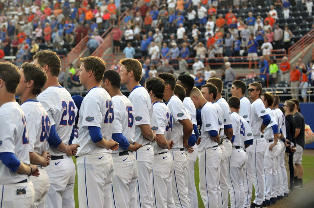 <p>UF lines up for the National Anthem on the third base line prior to Florida's 14-3 win over South Carolina on April 11, 2015, at McKethan Stadium.&nbsp;</p>